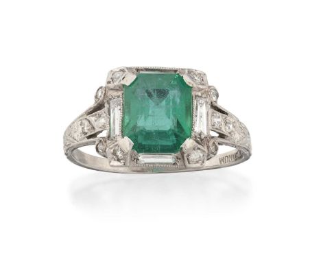 the emerald-cut emerald in a white claw setting, within a border of baguette cut and eight-cut diamonds in white millegrain s