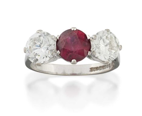 the round cut ruby flanked by round brilliant cut diamonds, in claw settings, to a tapered shoulder plain polished shank, tot
