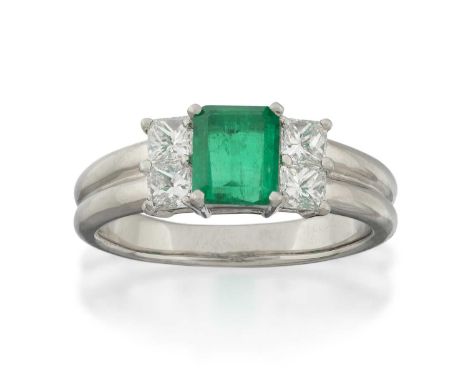 the emerald-cut emerald flanked by pairs of princess cut diamonds, in white claw settings, to a plain polished double row sha