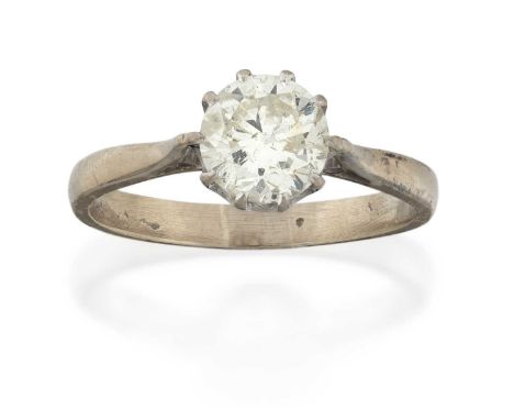 the round brilliant cut diamond in a white claw setting, to a tapered shoulder plain polished shank, estimated diamond weight