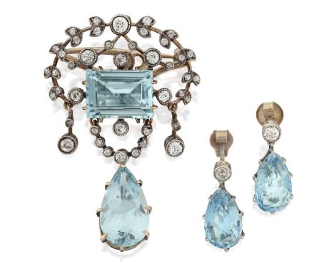 a step-cut aquamarine within an openwork scroll border set throughout with old cut diamonds, suspending old cut diamond and p