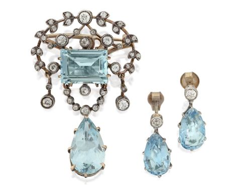 a step-cut aquamarine within an openwork scroll border set throughout with old cut diamonds, suspending old cut diamond and p