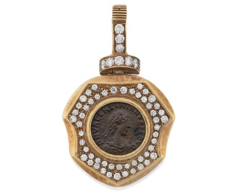 a yellow shield with a Roman coin centrally within a border of round brilliant cut diamonds, in pavé settings, suspended from