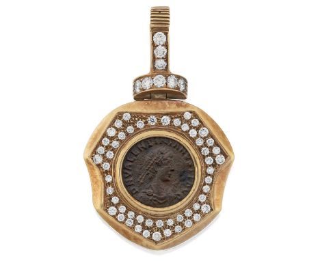 a yellow shield with a Roman coin centrally within a border of round brilliant cut diamonds, in pavé settings, suspended from