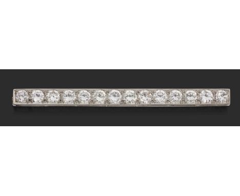 the fourteen round brilliant cut diamonds in white claw settings, within a plain polished rectangular frame, total estimated 