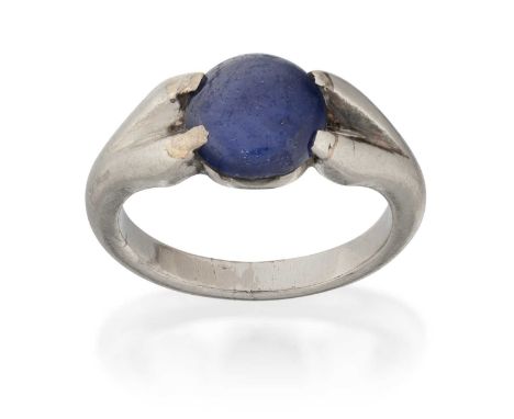 the round cabochon sapphire in a white four claw setting, to a plain polished shankfinger size K1/2The ring is in fair condit