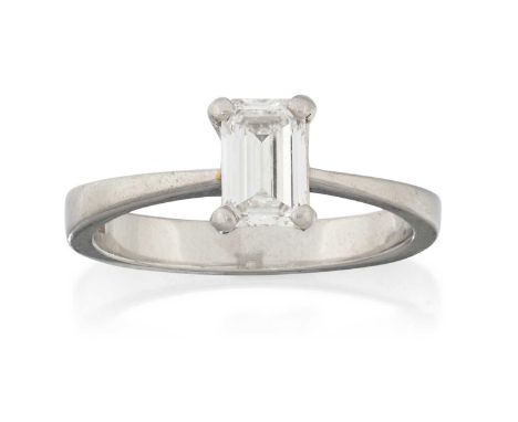 the emerald-cut diamond in a four claw setting, to a tapered shoulder plain polished shank, estimated diamond weight 0.75 car