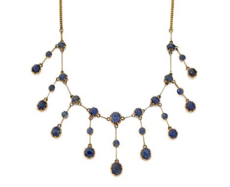 graduated drops set throughout with round and oval cut sapphires, in yellow claw settings, spaced by plain polished bars, to 