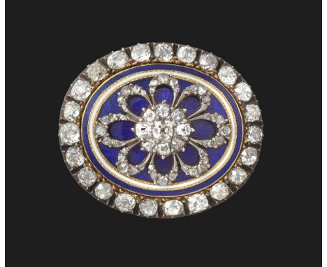a flowerhead cluster centrally composed of a cushion shaped diamond within a border of old cut diamonds, on a blue enamel gro