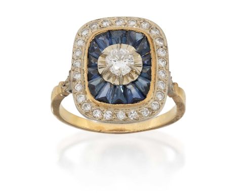 the round brilliant cut diamond in a white undulating setting, within a calibré cut synthetic sapphire border in yellow mille