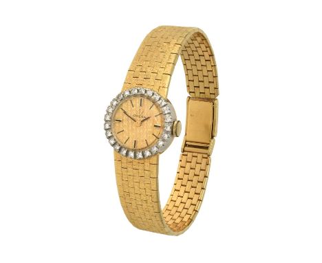 (calibre 485) manual wound lever movement signed, gold coloured textured dial with baton markers, diamond set bezel, snap-on 