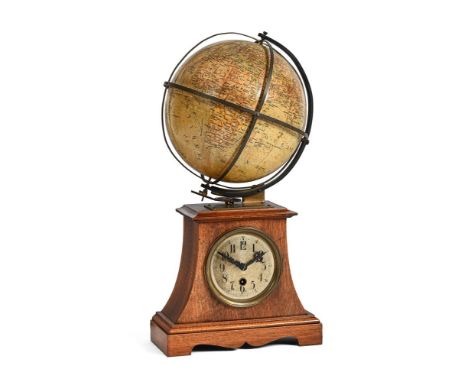 A WALNUT TERRESTRIAL GLOBE MANTEL TIME PIECE, UNSIGNED GERMAN, CIRCA 1905  43cm high, 21.5cm wide, 19cm deepThe circular move