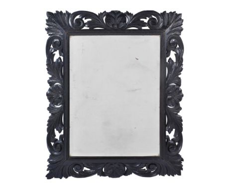 A VICTORIAN DARK OAK CARVED RECTANGULAR WALL MIRROR LATE 19TH CENTURY with bevelled plate82cm high, 64cm wide, 5cm deep Prove