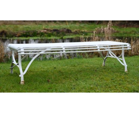 A HAND FORGED AND WHITE PAINTED 'ARRAS' BENCH OF RECENT MANUFACTURE 41cm high, 148cm wide, 52cm deep  Please note this lot wi