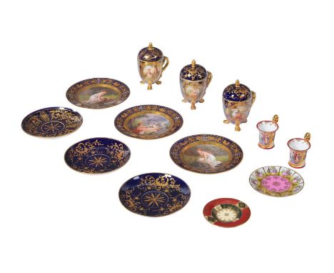 A GROUP OF BLEU ROI AND GILT GROUND PORCELAIN IN VIENNA STYLE, CIRCA 1900 Including three Vienna porcelain chocolate cups wit