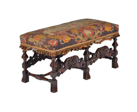 A WALNUT FRAMED STOOL IN WILLIAM AND MARY STYLE  LATE 19TH OR EARLY 20TH CENTURY needlework upholstered stuffed over seat, wi