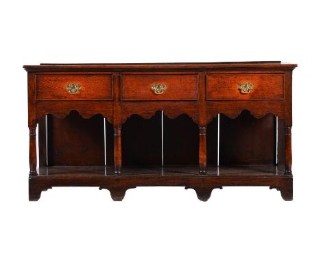 A GEORGE III OAK LOW DRESSER CIRCA 176080cm high, 158cm wide, 43cm deep TOGETHER WITH an associated wall mounted plate rack12