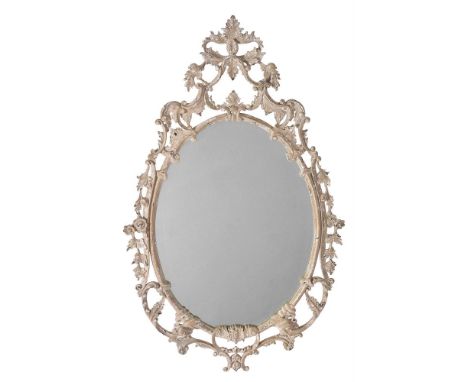A PAINTED OVAL FRETWORK WALL MIRROR  SECOND HALF 20TH CENTURY  116cm high, 72cm wide, 4cm protuberance    Provenance: Private