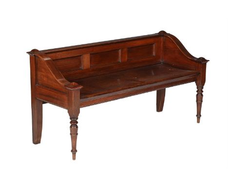 A VICTORIAN MAHOGANY HALL BENCH  CIRCA 1880  The panel back and arms above a dished seat and on turned legs to the front 75cm