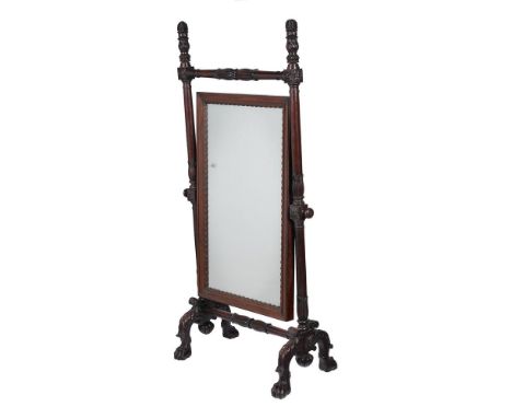 AN ANGLO-INDIAN CARVED HARDWOOD CHEVAL MIRROR  MID 19TH CENTURY  with concealed castors to the hairy-paw feet   182cm high, 8