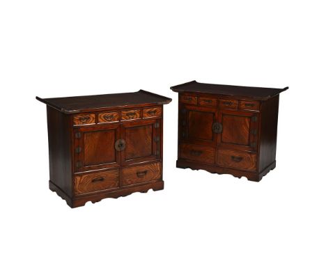 A PAIR OF KOREAN ELM SIDE CABINETS 19TH CENTURY Each with a flat top panel with flared ends bounded in metal, a pair of doors