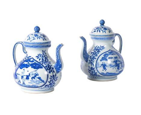 A PAIR OF CHINESE EXPORT OVERSIZED BLUE AND WHITE TEAPOTS  IN MING STYLE, 20TH CENTURY the teardrop shaped panel on either si