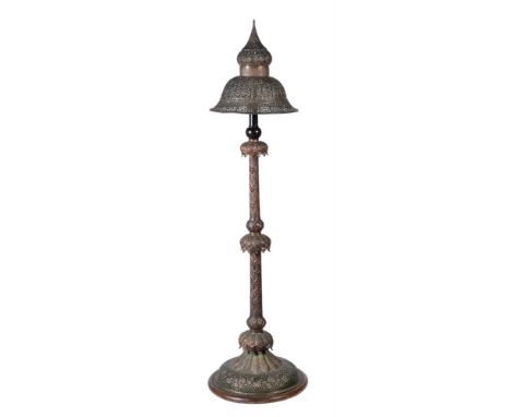 A MOORISH PIERCED AND BEATEN COPPER STANDARD LAMP 19TH CENTURY OR 20TH CENTURY 165cm high, 45cm diameter Provenance: Private 