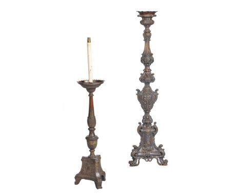 AN ITALIANATE SILVERED METAL FLOOR STANDING ALTAR CANDLESTICK 19TH CENTURY AND LATER with sham candle and shade135cm to bulb 