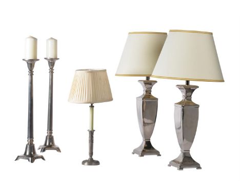 A GROUP OF CHROME OR STEEL LAMPS AND CANDLE HOLDERS MODERN including a pair of table lamps, a pair of tall candle holders, an