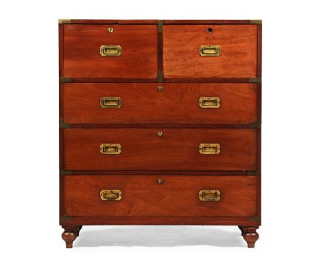 A HARDWOOD AND BRASS BOUND CAMPAIGN CHEST OF DRAWERS  MID 19TH CENTURY With secretaire drawer and short drawer above three fu