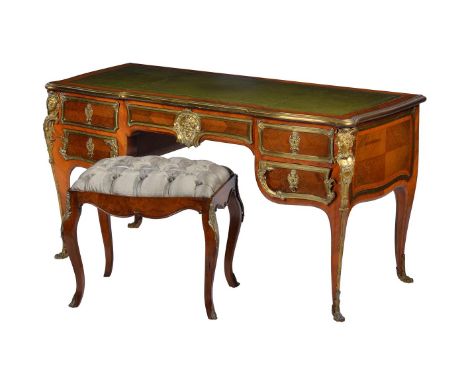 Y A ROSEWOOD VENEERED AND BRASS MOUNTED BUREAU PLAT IN LOUIS XV STYLE LATE 19TH CENTURYon cabriole supports 75cm high,144cm w