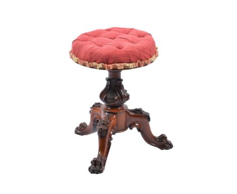 A MAHOGANY TRIPOD ADJUSTABLE PIANO STOOL WITH RED UPHOLSTERY  MID 19TH CENTURY  with lion paw feet and tufted upholstery  47.