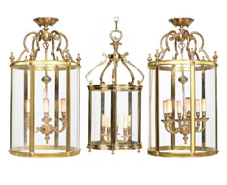 A PAIR OF GILT METAL HALL LANTERNS 20TH CENTURYeach 89cm high and 46cm diameter TOGETHER WITH Another lantern, modern, 85cm h