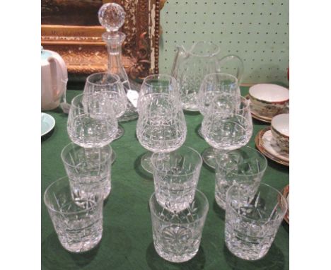 A suite of Waterford crystal, comprising: ship's decanter and stopper, water jug, six brandy balloons and six whisky tumblers