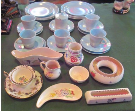 A Poole part-tea service, comprising six dinner plates, sugar bowl and five trios, together with other associated Poole potte