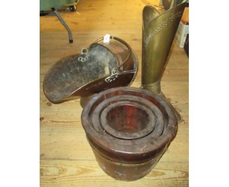 A copper coal scuttle, together with a brass stick stand in the form of a boot and a set of three wooden graduated flower tub