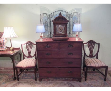 An impressive early 20th century walnut cased chiming mantle clock.