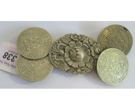 A Portuguese white metal ceremonial cloak clasp, composed of four large coin type fixings to a central foliate plaque.