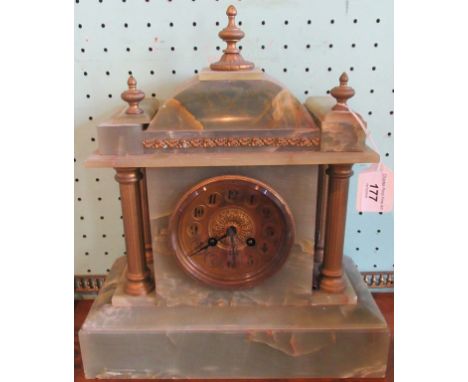 An onyx and gilt metal mounted mantle clock.
