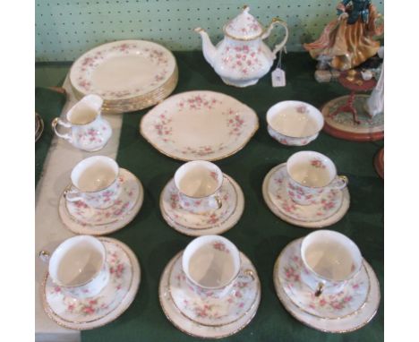 A Paragon Victoriana Rose pattern tea service, comprising: six dinner plates, cake plate, teapot, milk jug, sugar bowl and si