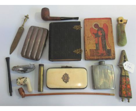 A quantity of miscellaneous items, to include: a small photo album, cigar case nut crackers, pipe and other related items.