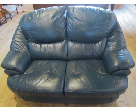 A contemporary blue leather two seater sofa.