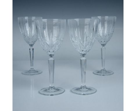 Four exquisite crystal goblets, meticulously hand-cut and polished to perfection. This item has its original box which measur