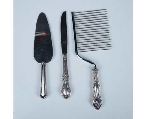 This collection includes a rounded cake or pie server with a sterling handle, a dinner knife with a sterling hollow handle, a