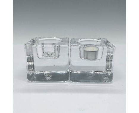 The Ice Cube Votive candle holder enhances the unique refractive qualities of crystal by shaping it into a massive cube, crea