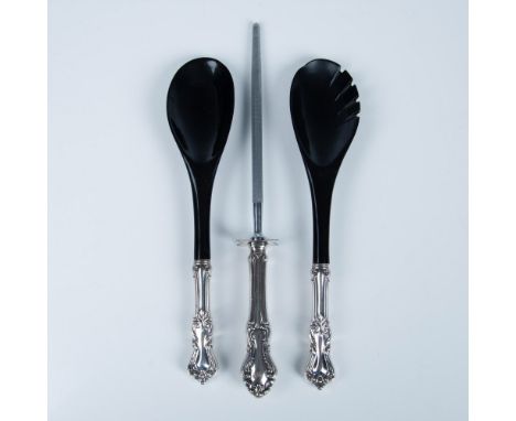 This silver grouping includes a pair of silver plated salad serving fork and spoon along with a honing steel and sterling sil