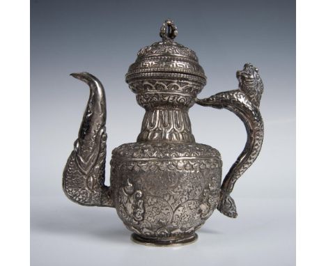 Teapot crafted in the traditional style with repousse work, originally used in Tibet for serving Yak tea. It showcases an ele