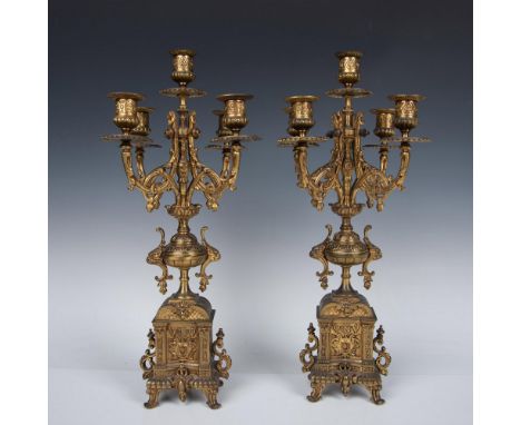 A set of two ornate candlestick holders, each with five extended embellished arms. Excellent moldings of acanthus scrolls and