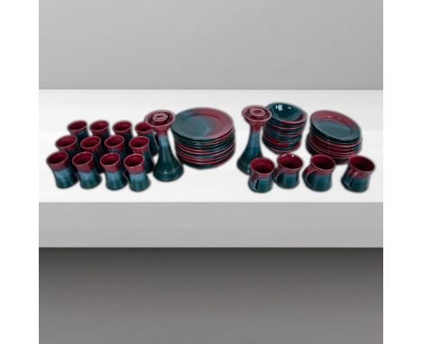 Exquisite set handcrafted and glazed in a jade green to mauve gradient. Set includes 12 bowls (2.5" H x 6.5" dia.), 12 cups (