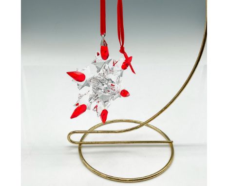Clear crystal limited edition annual Christmas snowflake with 2010 acid mark on crystal and light siam colored crystal tips. 